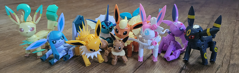 Eevee and each of it's evolutions, made of Mega blocks (off-brand Legos). They're like 2 inches tall, with posable limbs. These are official merch, not some great feat of creativity.