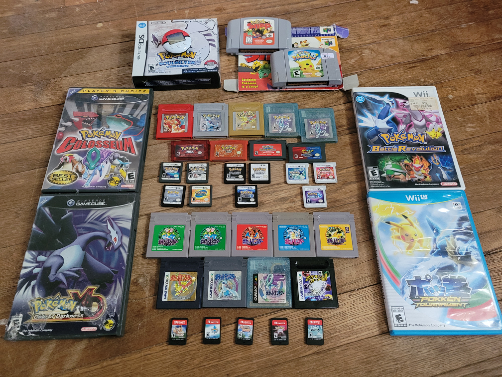 All of my Pokemon games laid out on the floor, loose cartridges, besides the console games. (Kinda long sorry.) We got Red, Silver, Gold, two Crystals, Ruby, Fire Red, Mystery Dungeon Red Rescue Team, Pinball Ruby and Sapphire, Diamond, Platinum, Soul Silver, Ranger, Black, White, Black 2, X, Omega Ruby, Moon, Let's Go Eevee, Sword, New Snap, Shining Pearl, Legends Arceus, Snap, Hey You Pikachu, Colosseum, XD Gale of Darkness, Battle Revolution, and Pokken Tournament. And Japanese copies of Green, Red, Blue, Yellow, Gold, Silver, Crystal, and the TCG game.
